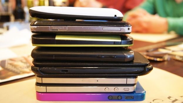 Snap shot of a tower of mobile devices, a game for teens
