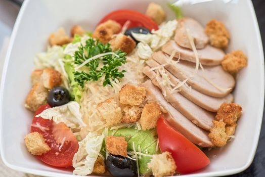 salad from ham crust cabbage, tomato cucumber olive greens and cheese 