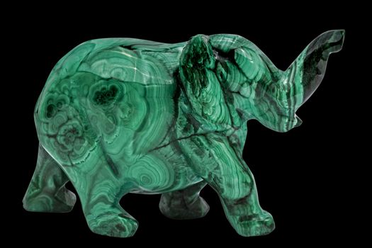 Elephant figurine from malachite, isolated on black background, with clipping path