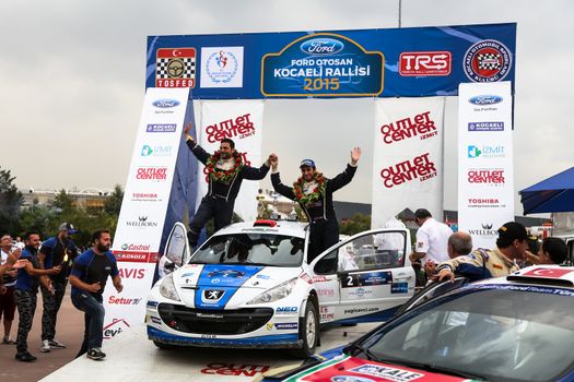 KOCAELI, TURKEY - AUGUST 23, 2015: Yagiz Avci with Peugeot 207 S2000 of Neo Motorspor Team in Podium Ceremony of Kocaeli Rally 2015