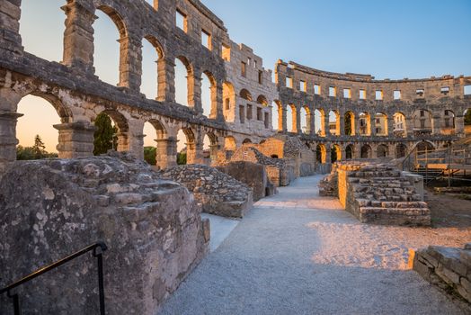 Inside of Ancient Roman Amphitheater in Pula, Croatia, Famous Travel Destination, in Sunny Summer Evening