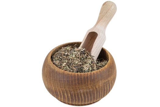 Portion of basil spice in wooden bowl isolated on white background with clipping path