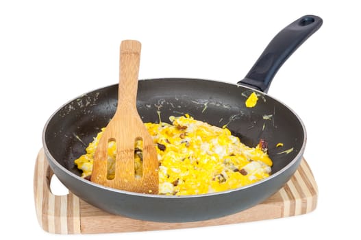 Scrambled eggs in a pan isolated on white background with clipping path