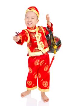 Chinese young boy in traditional Chinese cheongsam , isolated on white background