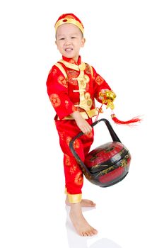 Chinese young boy in traditional Chinese cheongsam , isolated on white background