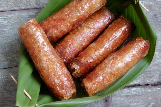 Vietnamese food, spring roll or cha gio, a delicious fried food with cylinder shape, eat with bun, salad and fish sauce, this also rich calories, cholesterol, fatty food, popular Vietnam eating