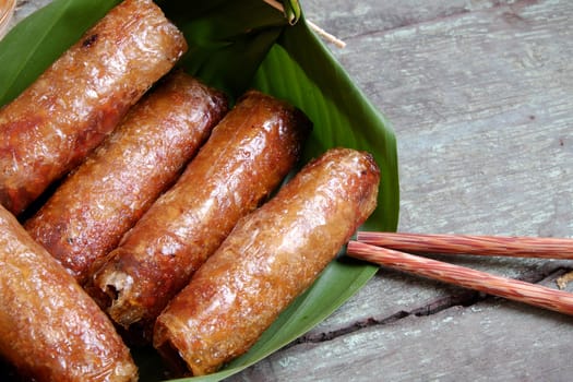 Vietnamese food, spring roll or cha gio, a delicious fried food with cylinder shape, eat with bun, salad and fish sauce, this also rich calories, cholesterol, fatty food, popular Vietnam eating