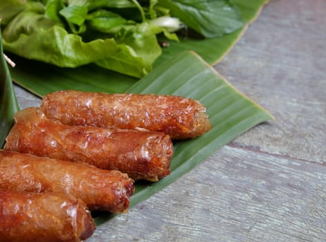 Vietnamese food, spring roll or cha gio, a delicious fried food with cylinder shape, eat with bun, salad and fish sauce, this also rich calories, cholesterol, fatty food, popular Vietnam eating