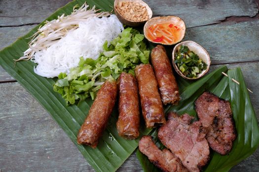 Vietnamese food, spring roll or cha gio, roast meat , a delicious fried food, eat with bun, salad and fish sauce, this also rich calories, cholesterol, fatty food, popular Vietnam eating