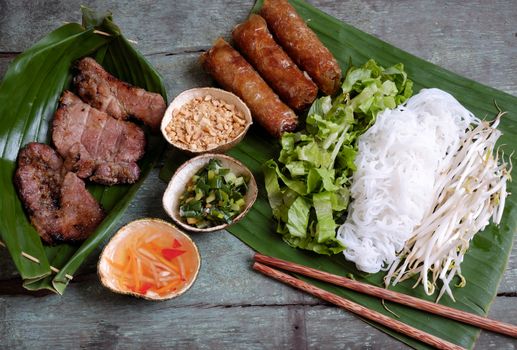 Vietnamese food, spring roll or cha gio, roast meat , a delicious fried food, eat with bun, salad and fish sauce, this also rich calories, cholesterol, fatty food, popular Vietnam eating