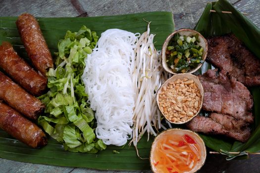 Vietnamese food, spring roll or cha gio, roast meat , a delicious fried food, eat with bun, salad and fish sauce, this also rich calories, cholesterol, fatty food, popular Vietnam eating