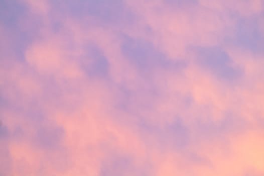 Autumn red gray clouds in the blue sky during the autumn sunset