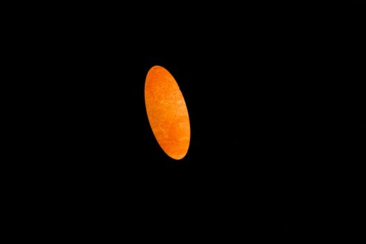 beautiful oval red fireball on a black background