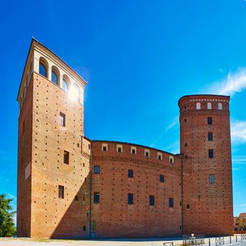 Fossano. The medieval castle by summer day
