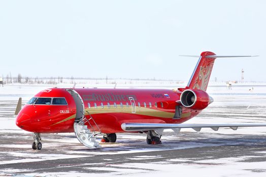 NOVYY URENGOY, RUSSIA - MARCH 23, 2013: RusLine Canadair Regional Jet CRJ-200ER at the Novyy Urengoy International Airport.