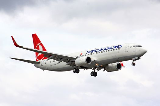 BERLIN, GERMANY - AUGUST 17, 2014: Turkish Airlines Boeing 737 arrives to the Tegel International Airport.