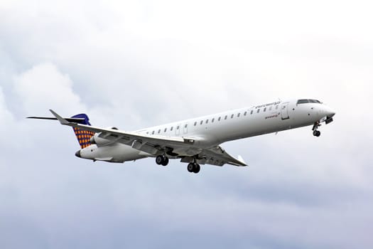 BERLIN, GERMANY - AUGUST 17, 2014: Eurowings Bombardier CRJ-900 NG arrives to the Tegel International Airport.