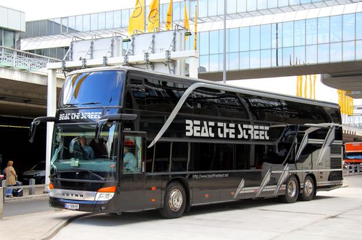 FRANKFURT AM MAIN, GERMANY - SEPTEMBER 13, 2013: Black Setra S431DT luxury interurban coach at the bus station at Flughafen International Airport.