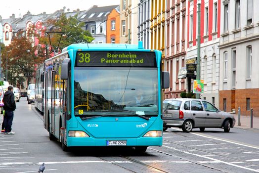 FRANKFURT AM MAIN - SEPTEMBER 15, 2013: Green Mercedes-Benz O530 Citaro city bus of Verkehrsgesellschaft Frankfurt am Main mbH bus company at the city street.