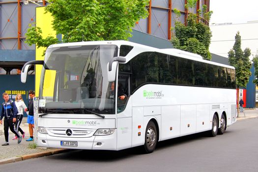 BERLIN, GERMANY - SEPTEMBER 12, 2013: White Mercedes-Benz O350-16RHD Tourismo coach at the city street.