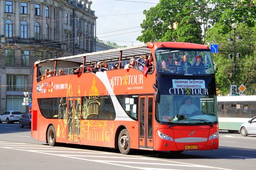 SAINT PETERSBURG, RUSSIA - MAY 27, 2013: Red UNVI Urbis city sightseeing bus at the city street.