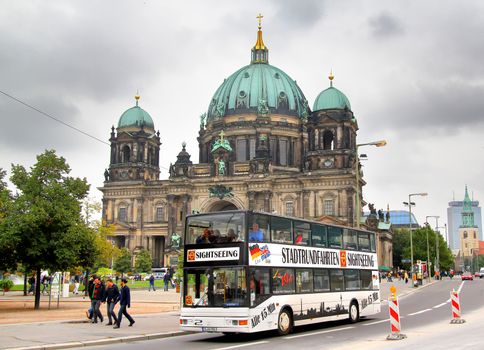 BERLIN, GERMANY - SEPTEMBER 12, 2013: MAN A14 ND202 city sightseeing bus at the city street.