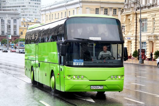 MOSCOW, RUSSIA - JUNE 3, 2012: Green Neoplan N1116 Cityliner interurban coach at the city street.