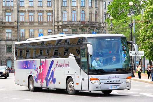 SAINT PETERSBURG, RUSSIA - MAY 25, 2013: Grey Setra S415GT-HD interurban coach at the city street.