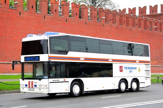 MOSCOW, RUSSIA - MAY 6, 2012: White Neoplan N4426/3U Centroliner mobile staff coach of the Ministry of Emergency Situations of Russia at the city street.