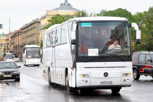 SAINT PETERSBURG, RUSSIA - MAY 26, 2013: White Mercedes-Benz O350RHD Tourismo interurban coach at the city street.