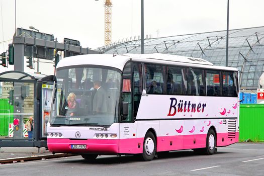 BERLIN, GERMANY - SEPTEMBER 12, 2013: Pink Neoplan N316SHD Euroliner interurban coach at the bus station.