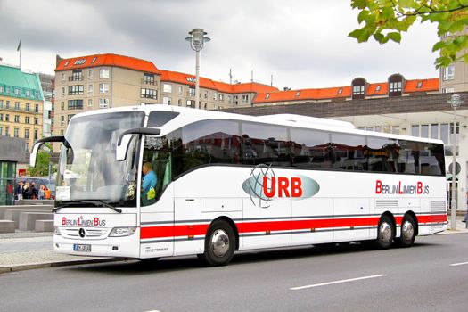 BERLIN, GERMANY - SEPTEMBER 12, 2013: White Mercedes-Benz O350-16RHD Tourismo interurban coach at the city street.