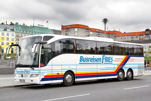 BERLIN, GERMANY - SEPTEMBER 12, 2013: White Mercedes-Benz O350-16RHD Tourismo interurban coach at the city street.