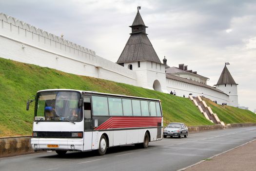 KAZAN, RUSSIA - AUGUST 20, 2011: White Setra S215HR interurban coach near the wall of the Kazan Kremlin.