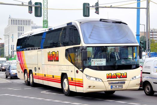 BERLIN, GERMANY - SEPTEMBER 12, 2013: Yellow Neoplan N1218HDL interurban coach at the city street.