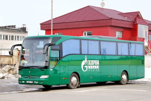 NOVYY URENGOY, RUSSIA - APRIL 20, 2013: Green Mercedes-Benz O350-15RHD Tourismo interurban coach at the bus station.