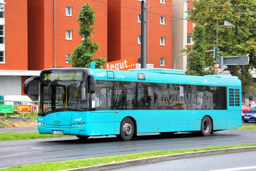 FRANKFURT AM MAIN, GERMANY - SEPTEMBER 16, 2013: Cyan Solaris Urbino 12 city bus at the city street.