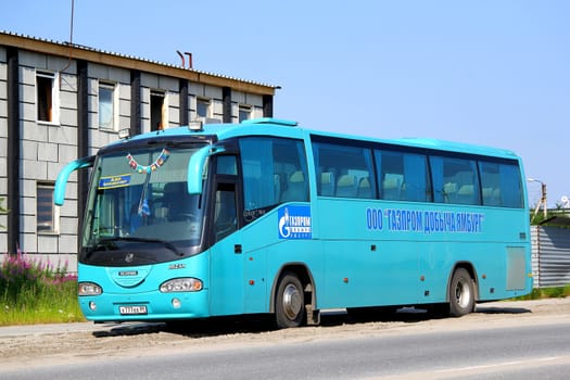 NOVYY URENGOY, RUSSIA - JULY 17, 2013: Cyan Irizar Century interurban coach at the city street.