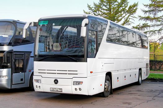 MOSCOW, RUSSIA - MAY 5, 2012: White Mercedes-Benz O350SHD Tourismo interurban coach at the city street.