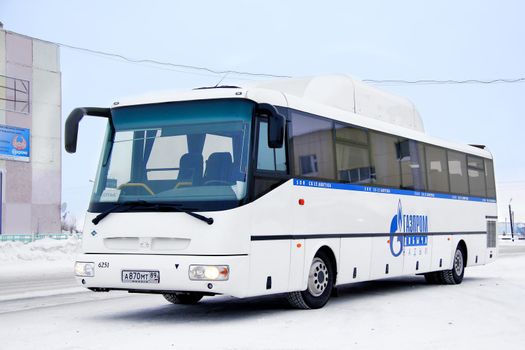 PANGODY, RUSSIA - FEBRUARY 4, 2013: White SOR CG12 Arktika interurban coach ran on a gas fuel at the city street.