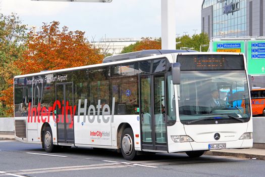 FRANKFURT AM MAIN, GERMANY - SEPTEMBER 13, 2013: White Mercedes-Benz O530 Citaro suburban bus at the city street.