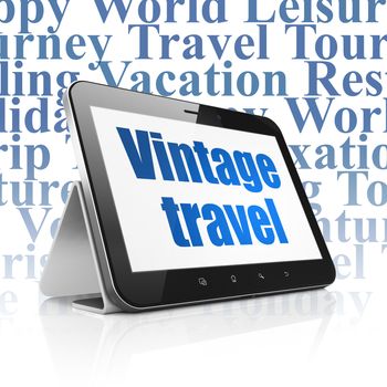 Vacation concept: Tablet Computer with  blue text Vintage Travel on display,  Tag Cloud background