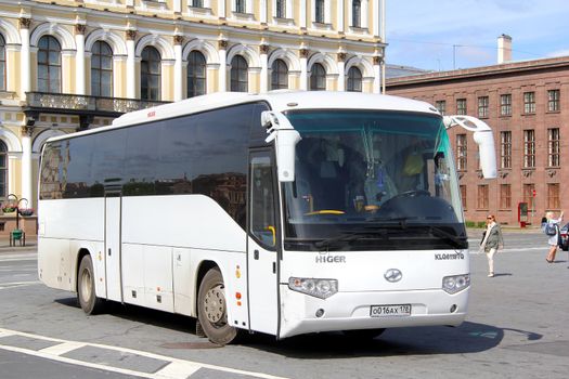 SAINT PETERSBURG, RUSSIA - MAY 25, 2013: White Higer KLQ6119TQ interurban coach at the city street.