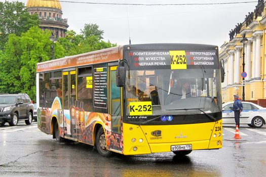 SAINT PETERSBURG, RUSSIA - MAY 26, 2013: Yellow MAZ 206 city bus of the Tretiy Park bus company at city street.
