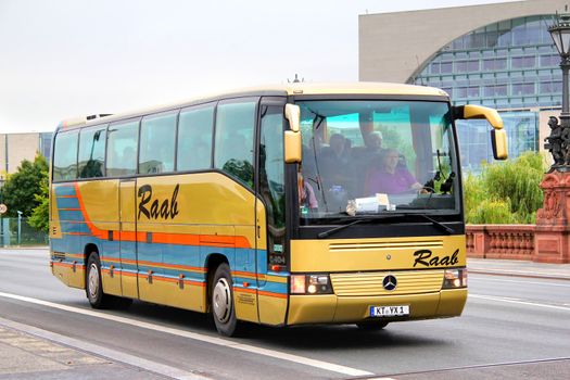 BERLIN, GERMANY - SEPTEMBER 10, 2013: Golden Mercedes-Benz O404 interurban coach at the city street.