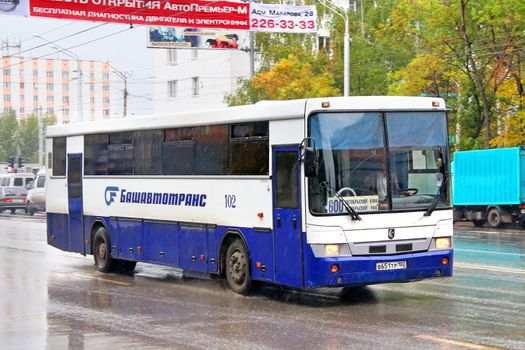 UFA, RUSSIA - OCTOBER 1, 2011: White and blue NEFAZ 5299 interurban coach at the city street.