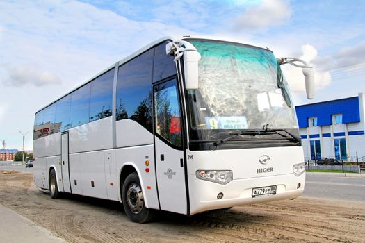 NOVYY URENGOY, RUSSIA - AUGUST 26, 2012: White Higer KLQ6129Q interurban coach at the city street.