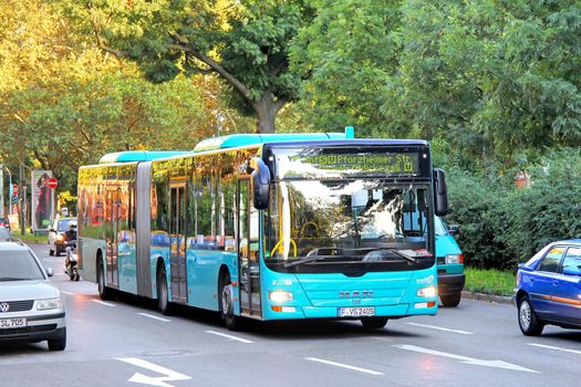 FRANKFURT AM MAIN, GERMANY - SEPTEMBER 13, 2013: MAN A23 Lion's City G articulated bus of the Verkehrsgesellschaft Frankfurt am Main mbH bus company at the city street.