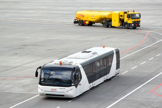 MOSCOW, RUSSIA - SEPTEMBER 9, 2013: White Neoplan N9122 airport bus at the Vnukovo international airport.