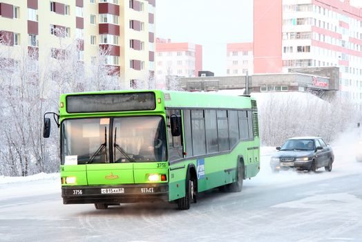 NOVYY URENGOY, RUSSIA - NOVEMBER 28, 2012: Green MAZ 103 city bus at the city street.
